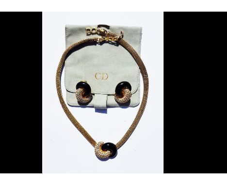 A Christian Dior necklace and earring set, black enamel and paste stones, within a pave setting, necklace on a flattened oval