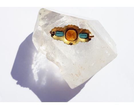 An Edwardian gold, seed pearl, tourmaline and citrine brooch, missing pin, the cushion shaped citrine flanked by two rectangu