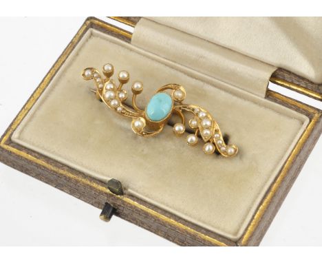 An Edwardian 15ct gold turquoise and seed pearl brooch, of scroll design marked 15ct to back, in fitted Goldsmiths and Silver