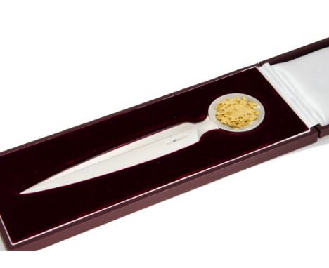 A 1970s fine silver letter opener from Grant Macdonald, presented in a fitted GM maroon box, the dagger shaped blade having r