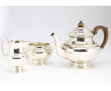 A George V silver three piece tea set from S Ltd, Birmingham 1930, comprising teapot, sugar basin and milk jug, 32 ozt