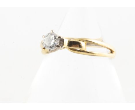 An 18ct gold diamond solitaire, the brilliant cut diamond in six claw setting on a scroll and pierced yellow gold shank, ring