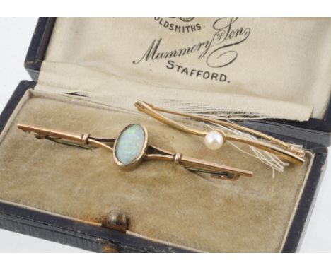 An Edwardian yellow metal and precious opal bar brooch, marked 9ct in a fitted leather box from Mummery &amp; Son Stafford, t