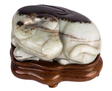 A CHINESE GRAY AND DARK BROWN JADE CARVING OF A WATER BUFFALO, QING DYNASTY, 1644-1911the recumbent horned buffalo naturalist