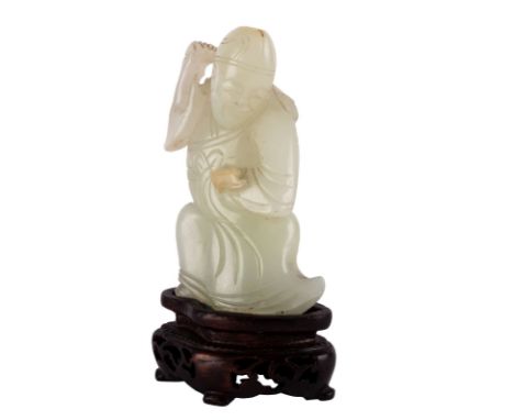 A CHINESE PALE CELADON JADE FIGURE OF A SAGE, QING DYNASTY, 18-19TH CENTURYcarved in the form of a long-robed kneeling sage h