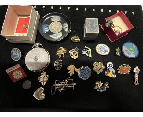 A job lot of assorted enamel badges and other collectables 