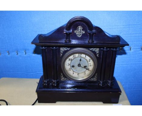A wooden cased Edwardian mantle clock with key and pendulum, shipping unavailable 