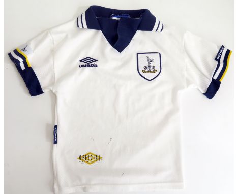 A Tottenham Hotspur child’s shirt, signed by Osvaldo Ardiles and others.*SOLD WITH A LETTER OF CONFIRMATION STATING THE ABOVE