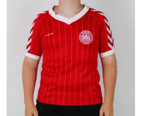 A Denmark international home shirt 1983-84 bears No. 8 to the back for Jesper Olsen, for the 1984 European qualifying group 3