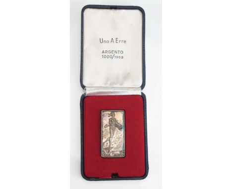 A silver ingot with low relief figure of a blindfold female nude, entitled “l lingottino Della Fortuna” (The Ingot of Fortune