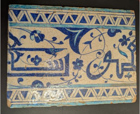 An 18th or 19th century Multan calligraphic tile, 31cm x 23.5cm x 2cm&nbsp;