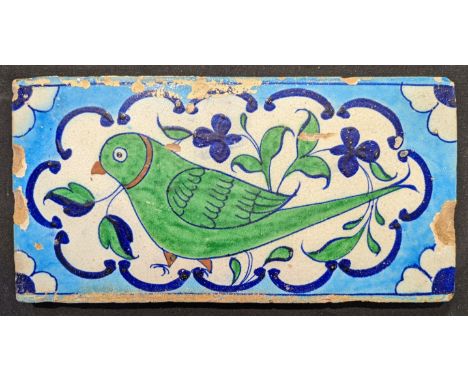 A 19th century Indian multan tile depicting a parrot, H.15.5cm W.30cm