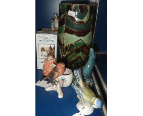 A GREEN GLAZED POOLE POTTERY VASE with stylised decoration, a Royal Albert Beatrix Potter figure and similar decorative ceram