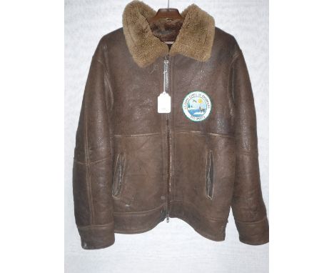 A GENTLEMAN'S SUEDE FLYING JACKET, with lined interior, with attached badge 'U.S. Army Corps of Engineers, Eco-Meets'