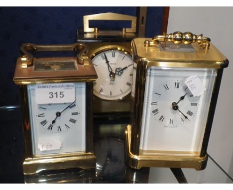 A BRASS-CASED CARRIAGE CLOCK and two others similar