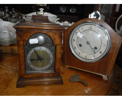 A 1950'S BRACKET CLOCK in a burr-walnut case (with electric movement) and an oak-cased mantel clock (2)