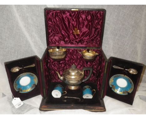 A PRESENTATION THREE PIECE SILVER TEASET in leather presentation case with accompanying cups, saucers and fittings, the case 