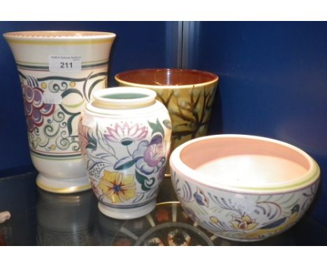 A POOLE POTTERY VASE with traditional hand painted decoration and three similar items of Poole Pottery