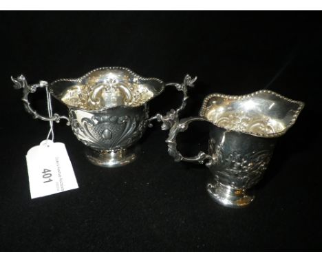 A SILVER TWO HANDLED BOWL AND MATCHING JUG by William Hutton & Sons, hallmarked for Birmingham, 1905