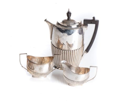 Various makers, Sheffield 1912, Birmingham 1909 & 1910, comprising a coffee pot, milk jug and sugar basin, the oval bodies ha