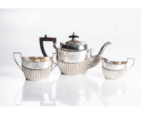 Williams (Birmingham) Ltd., Birmingham 1904, comprising a teapot, milk jug and sugar basin, the oval bodies half-lobed, each 