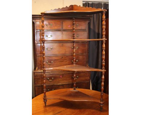 19thC Mahogany 4 shelf corner unit with scroll back and turned supports and brass feet 