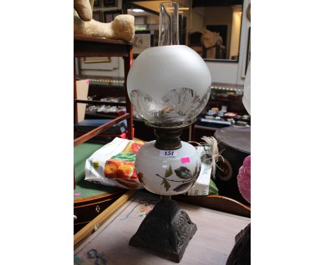 19thC Oil Lamp with Glass reservoir with floral decoration and cast metal base 