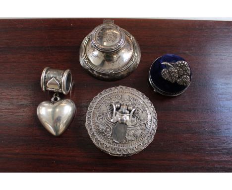 Asian White metal powder pot, Edwardian Silver Inkwell, Silver mounted Pin cushion, Heart Napkin holder and a Silver pin broo