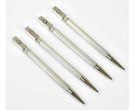 A cased set of four sterling silver bridge pencils with engine turned decoration.