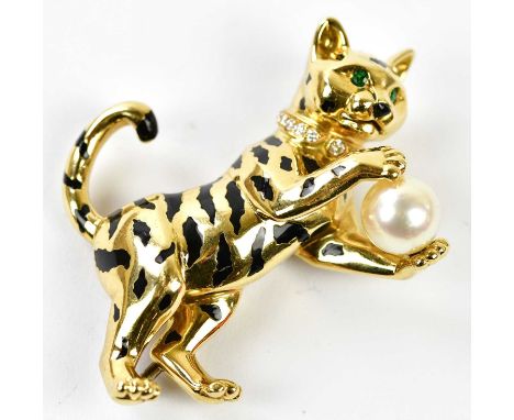 CARTIER; an 18ct yellow gold black enamel diamond, emerald and pearl set brooch in the form of a cat, signed and with number 