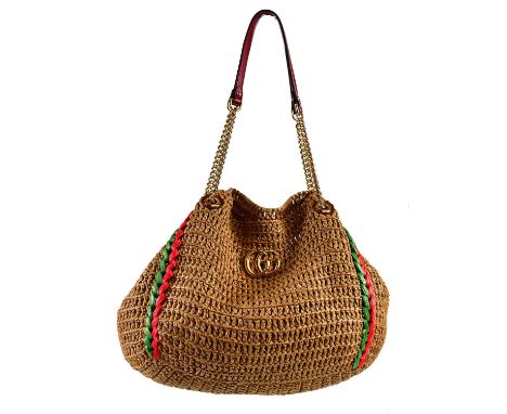 GUCCI; a large light brown GG Marmont crochet raffia tote bag with gold tone to sides, GG logo to front, green and red raffia