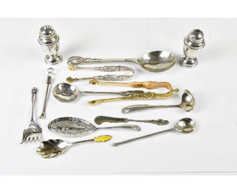 AMY SANDHEIM; a George V hallmarked silver spoon in the Arts and Crafts style with pierced handle and planished bowl, London 