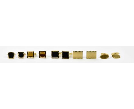 A pair of 9ct yellow gold and black onyx cufflinks, a further pair of 9ct yellow gold oval cufflinks, one with engraved platf