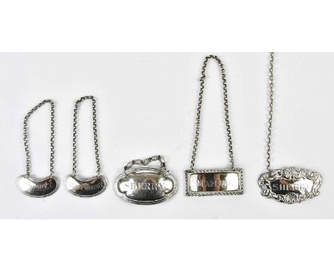 WILLIAM NEALE LTD; a George V hallmarked silver decanter label with cast edge 'Madeira', a further hallmarked silver decanter