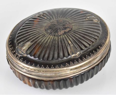 A George III tortoiseshell snuff box of oval form, with white metal mounts and borders and engraved initials, width 9.5cm.