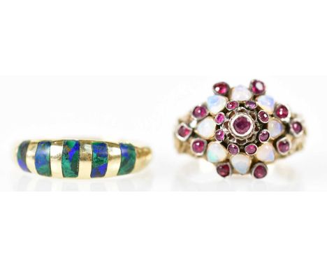 Two yellow metal dress rings, one with unusual dome setting set with opals, size L 1/2, the second with bands of malachite, s