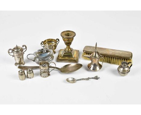 A small collection of various of hallmarked silver and white metal items to include a weighted candlestick, a dressing table 