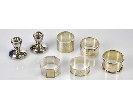 LAWRENCE R WATSON &amp; CO; a pair of Elizabeth II hallmarked silver squat candlesticks, Birmingham 1987, and five hallmarked