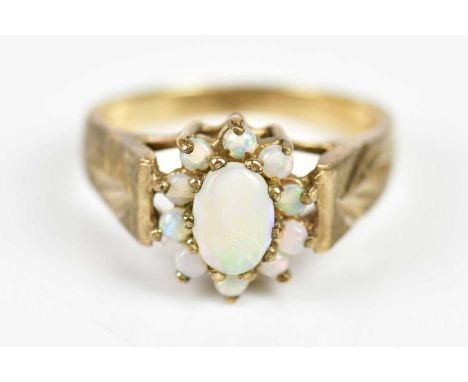 A 9ct yellow gold opal ring, size O, weight 3.9g.