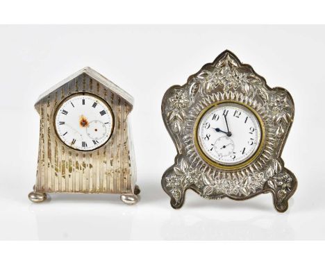 NATHAN &amp; HAYES; a Victorian hallmarked silver easel back travelling clock, with embossed decoration, the enamel dial set 