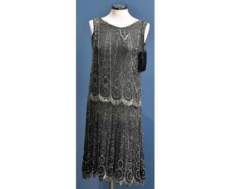 An original French 1920s sheer black silk chiffon flapper dress with silver bugle beads to hips and abstract design beading t