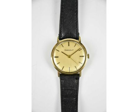 CARAVELLE; a 9ct gold cased manual wind wristwatch, enscribed to back "F.J.CAYGILL 1956-77 21 YRS service from directors of J