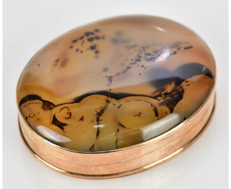 A Continental snuff box, yellow metal mounted and honey coloured agate set 'a jour' of oval form, length 5.5cm, Messrs Christ