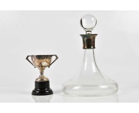 CARRS OF SHEFFIELD LTD; an Elizabeth II hallmarked silver rimmed decanter, Sheffield 2006, together with a twin handled troph