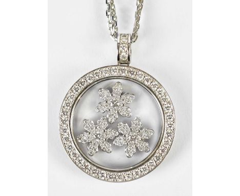 CHOPARD; an 18ct white gold diamond set 'Happy Snowflakes' pendant on double link chain, signed, length of chain 40cm, diamet