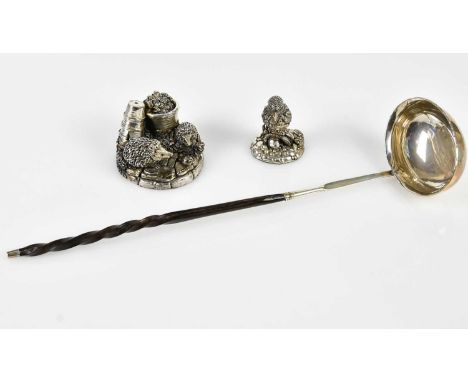 A Georgian white metal toddy ladle with turned whale bone handle, and two modern hallmarked silver models of animals comprisi