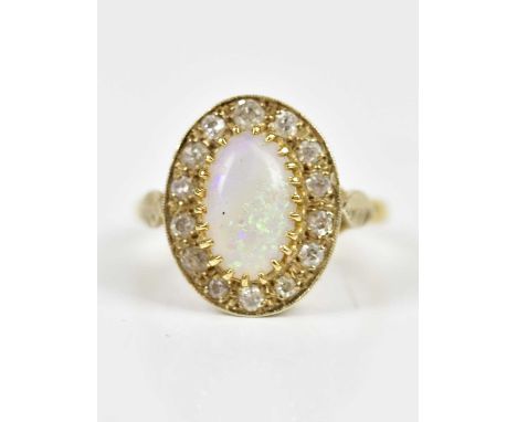 An 18ct yellow gold dress ring, set with a central opal approx 50x25mm, size P, 7.2g.Condition Report: A few scuffs to the su