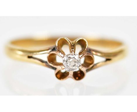 An 18ct yellow gold single stone diamond ring with flower head setting, size P 1/2, approx 1.8g.