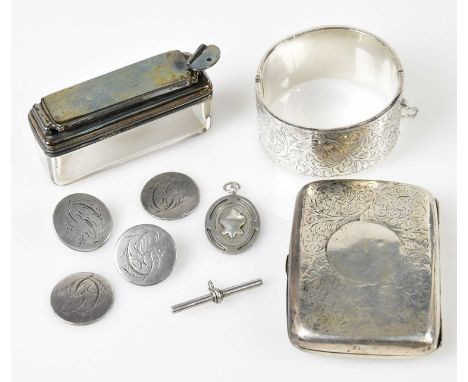An Edwardian hallmarked silver cigarette case (repaired), Birmingham 1908, a silver topped travelling inkwell with glass base