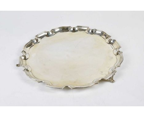 WILLIAM ADAMS LTD; a George V hallmarked silver salver with cast scalloped edge on sabre legs, Birmingham 1932, approx weight